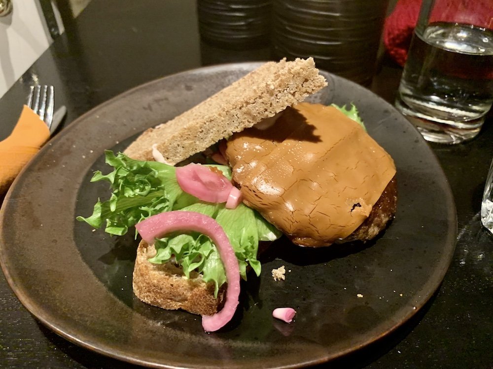 a reindeer burger with norwegian brown cheese and norwegian rye bread