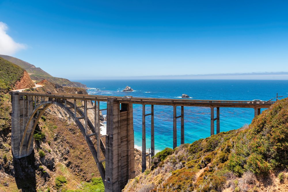 the famous archway at bixby creek bridge in big sur looking over the pacific ocean