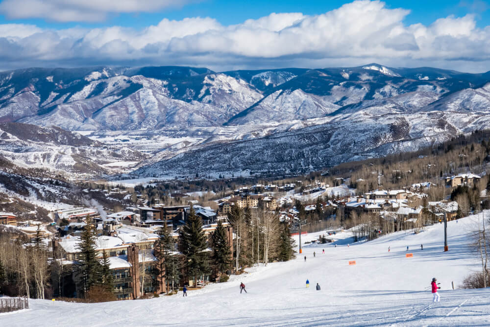 details of the aspen ski resort scene with manicured ski paths and mountains and resort below