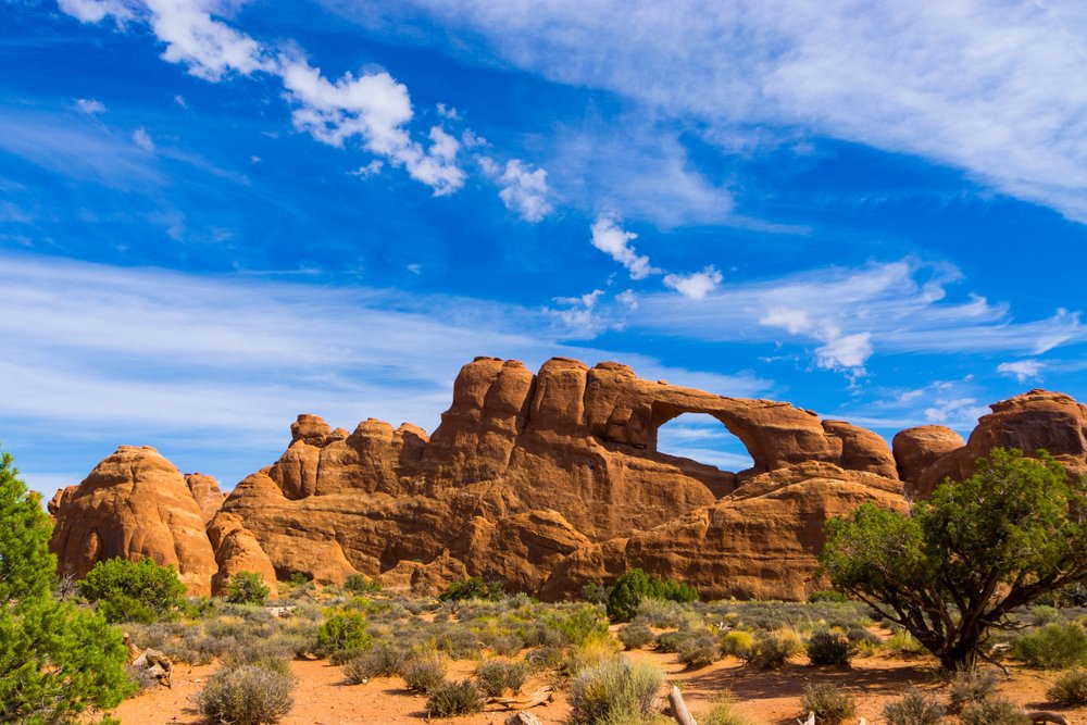 skyline arch seen with brilliant colors and red rocks.