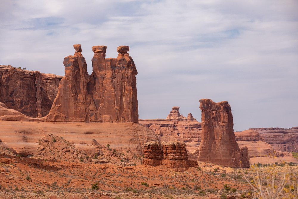 the famous 'three sisters' rock formation seen from the la sal mountains viewpoint in arches national park