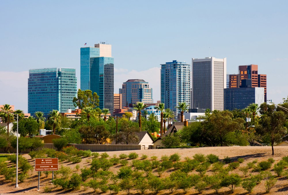 Architecture of downtown Phoenix: blue, brown, and white buildings in a desert landscape.
