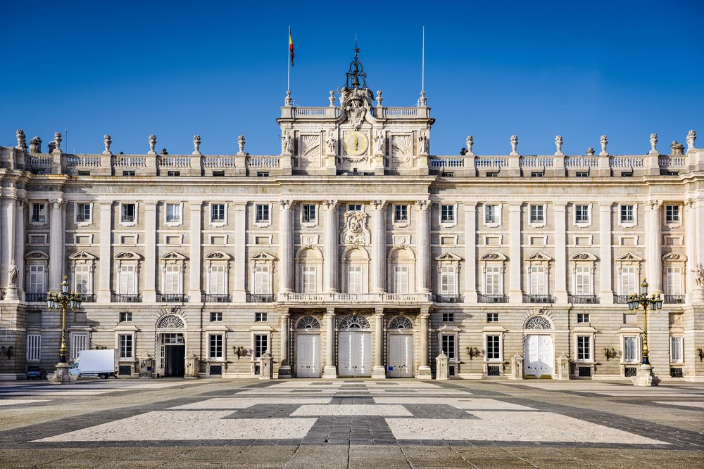 A symmetrical view of an ornate gray colored palace