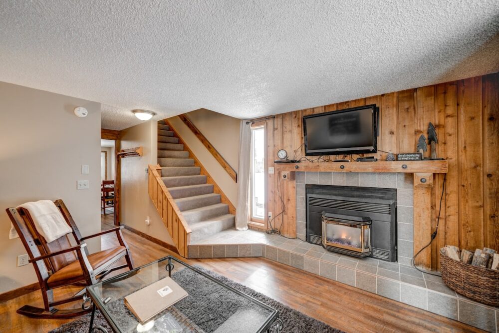 Rustic designed Airbnb near Yellowstone with wood paneling and white walls and vintage-inspired furnishings