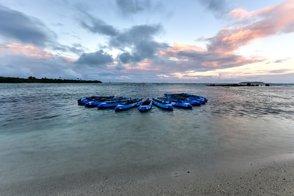 kayaks at sunset awaiting guests to go on a bio bay tour of the lagoon in fajardo puerto rico