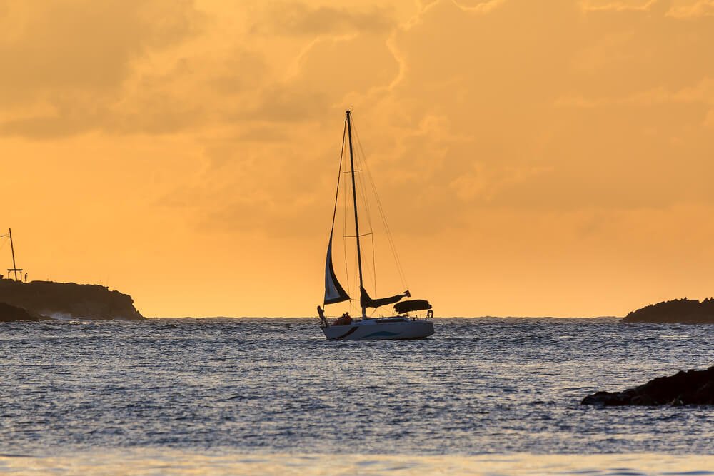 Silhouette of a sailing boat at sunset in the Caribbean in San Juan, Puerto Rico