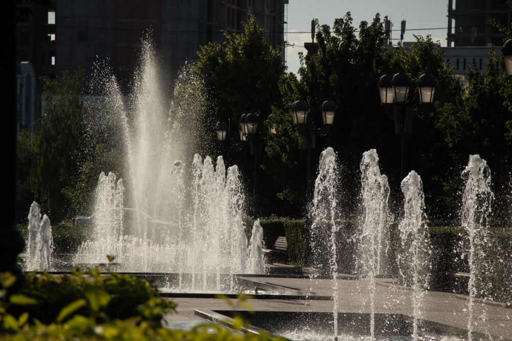 Several jet fountains in the middle of a pedestrian walkway on a SLC itinerary