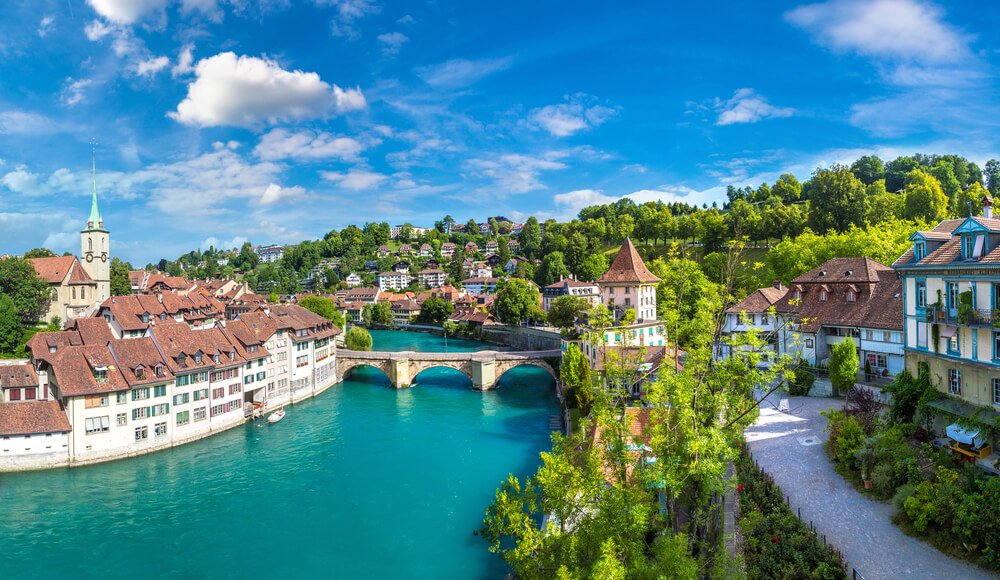 view of the city of bern and its aare river that is brilliant turquoise running through it