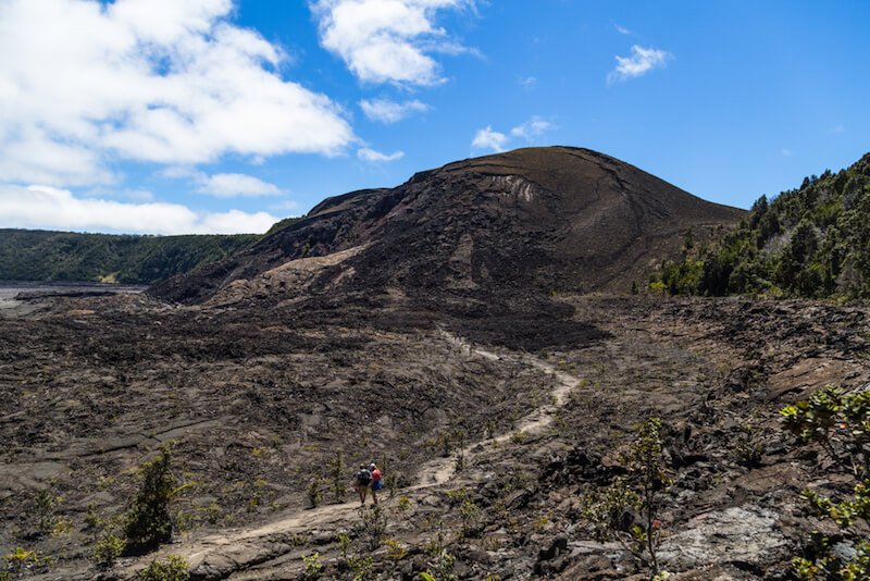 volcano hike in hawaii wiht a trailhead leading to a volcano