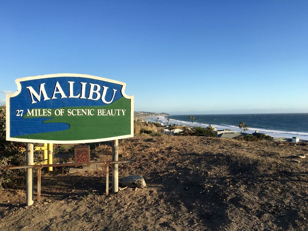 Road sign for Malibu that reads 27 miles of scenic beauty