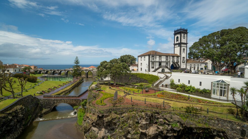 the peaceful town of ribeira grande with its river, church, park, and bridges