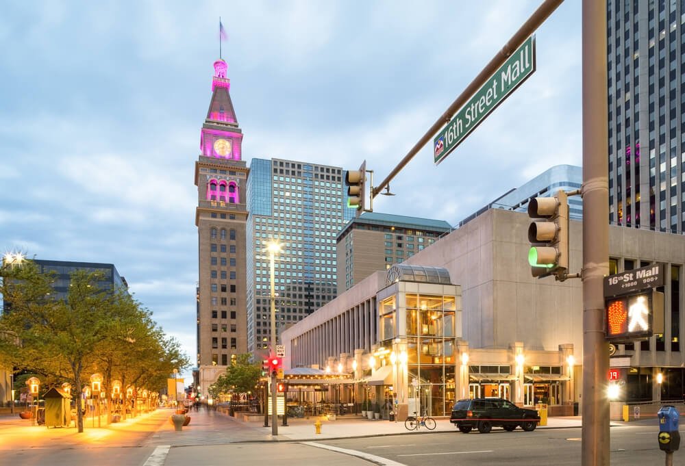 The 16th street mall lit up in colorful lights at dusk