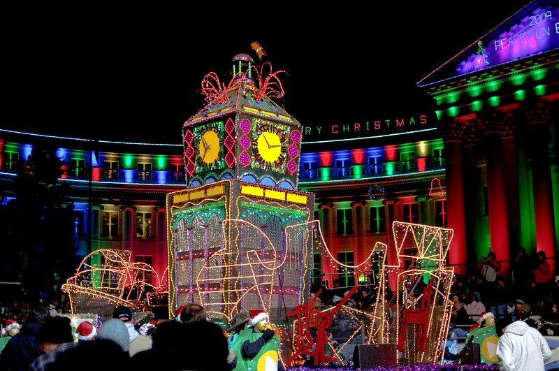 Colorful Christmas lit up floats at a parade