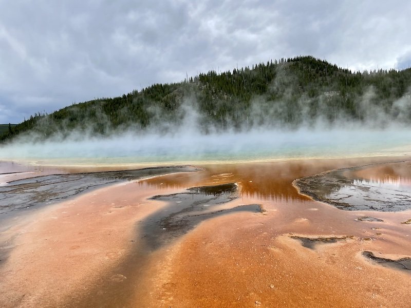 view of grand prismatic spring from up close and personal on the boardwalk