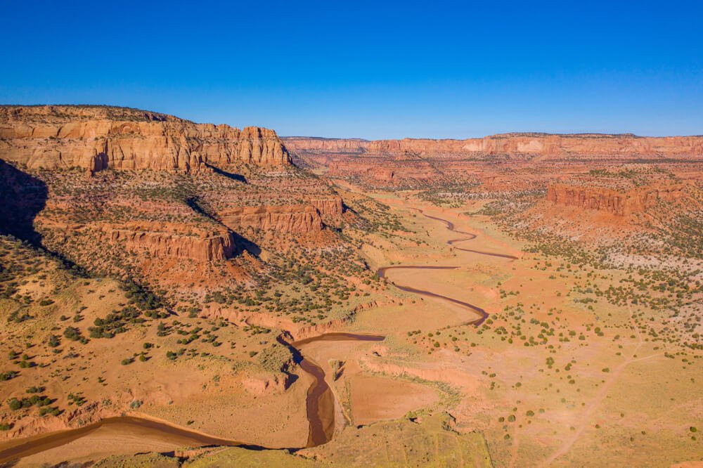 Canyon de Chelley red rock landscape with a river snaking below it