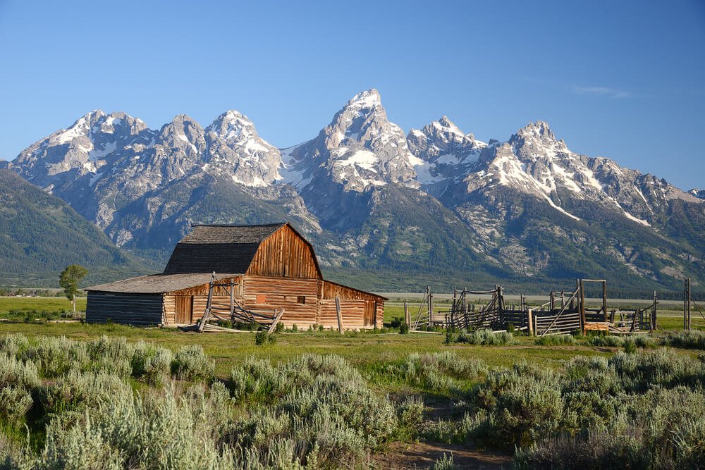 The historic barn or homestead along Mormon Row with the Teton Range in the background