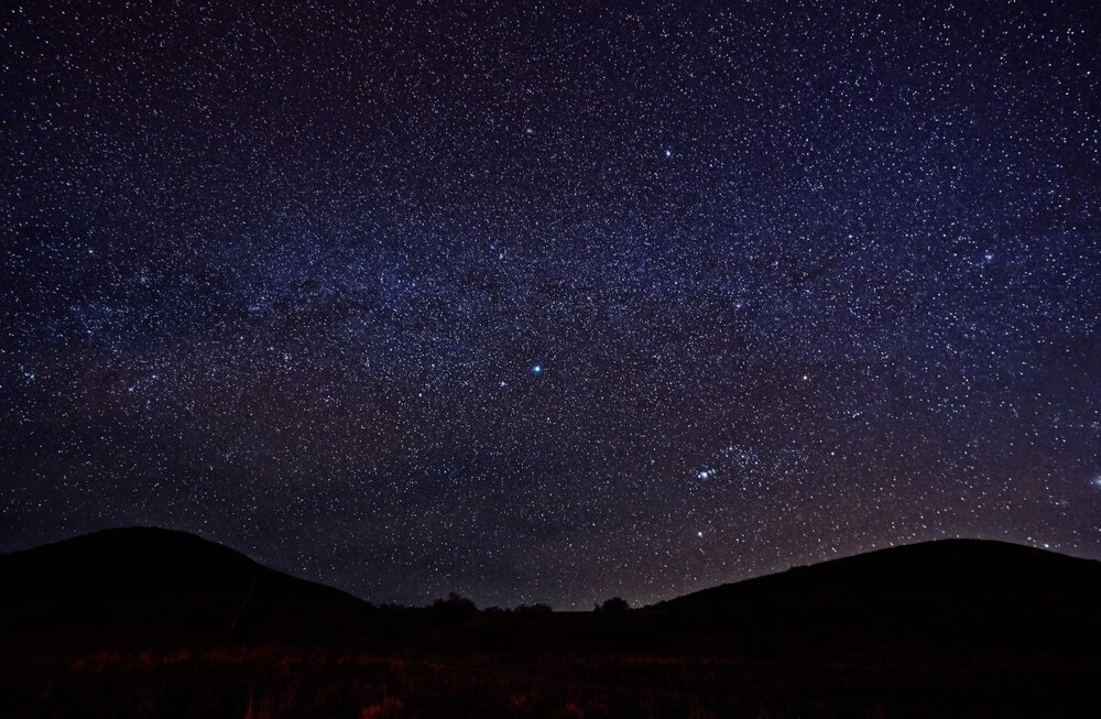 Purple night sky studded with millions of stars on Mauna Kea