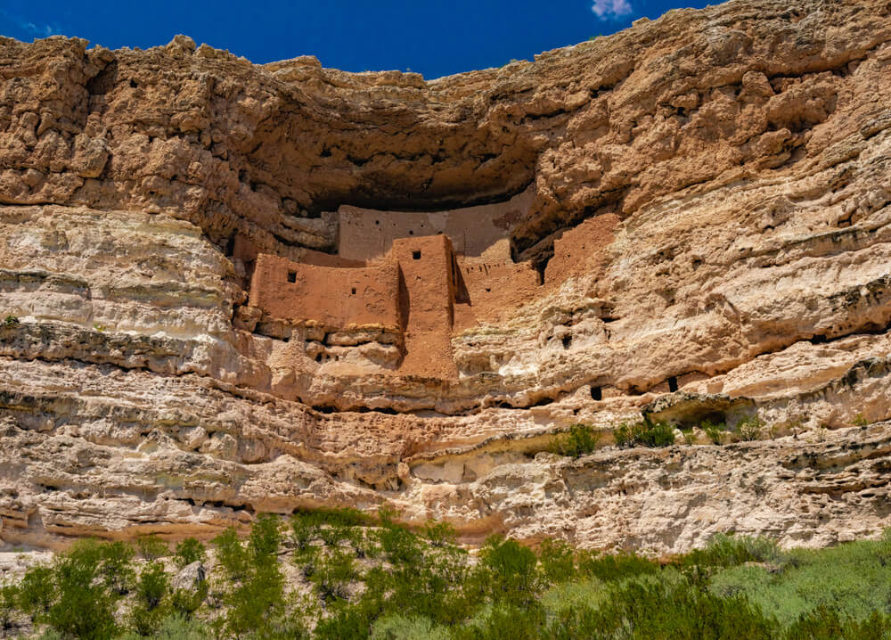 The scenic Montezuma Castle carved out of a cliff, a pueblo cliff dwelling of the ancient Indigenous peoples of Arizona