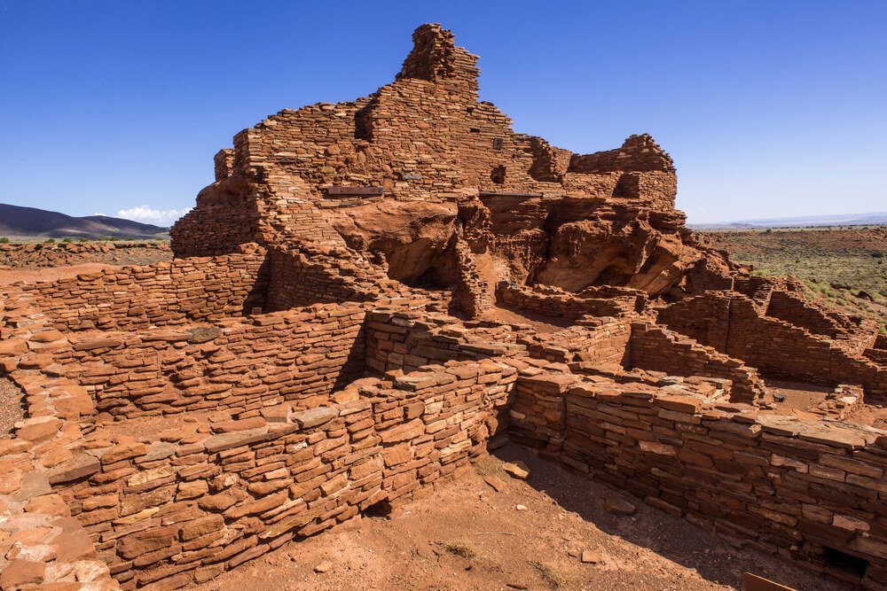 Historic Wupatki Ruin at Wupatki National Monument in Arizona, made of red rocks that look like bricks