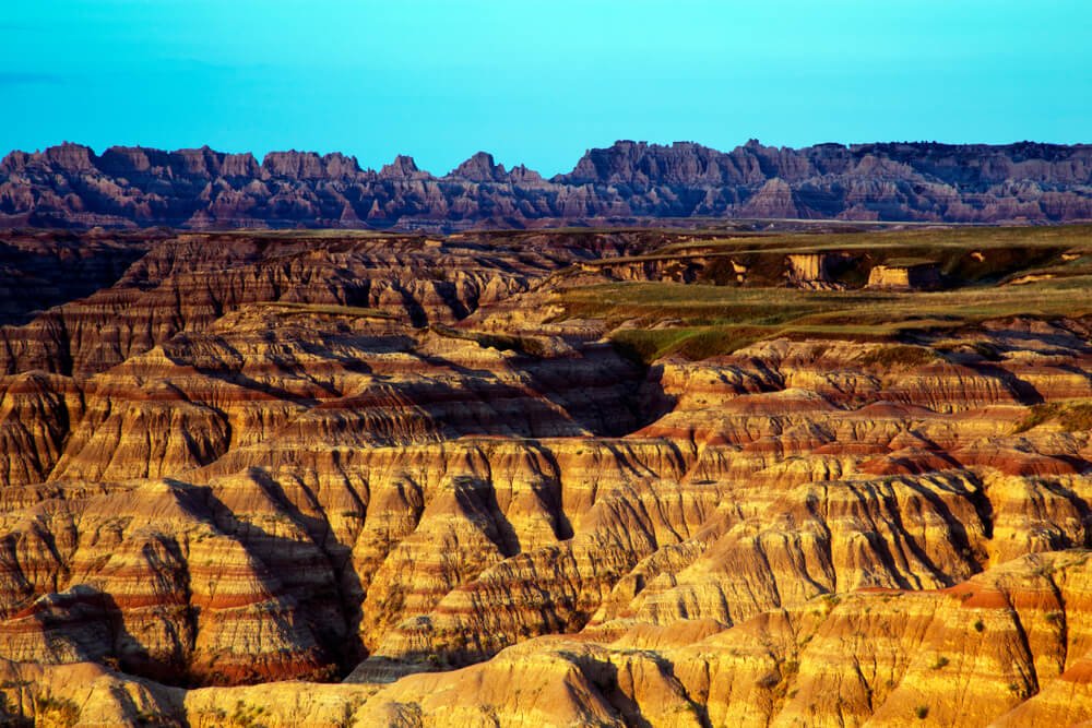 Striations in the rock formations of the pinnacles in the Badlands national park of south dakota at sunset