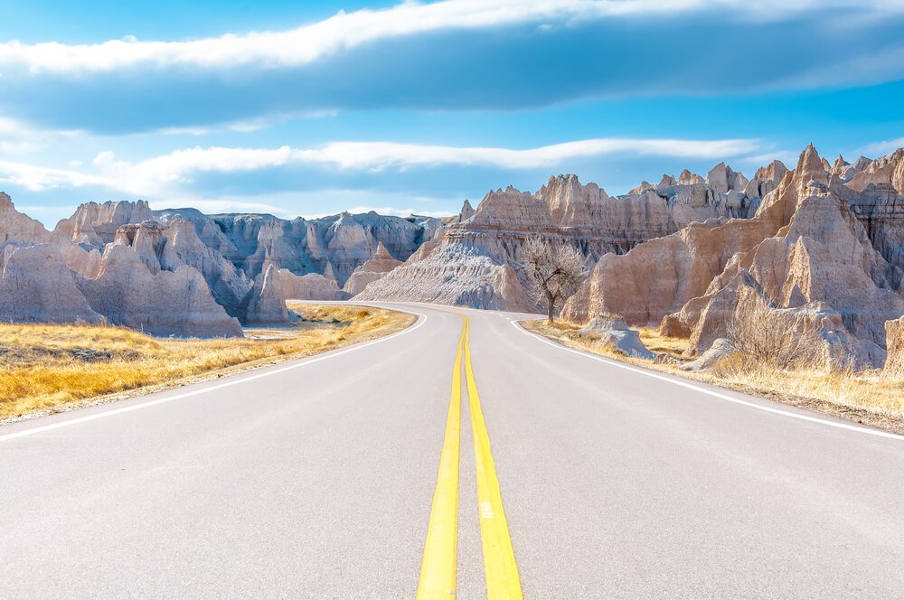 Taking the scenic Badlands Loop, driving on an empty road in the Badlands in South Dakota