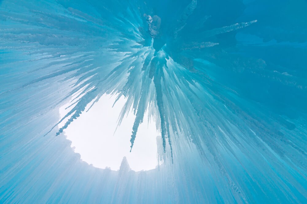 Looking up at the icicles under one of the arches in Dillon Ice Castles