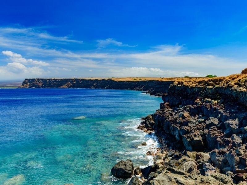 the ka lae south point coastline, the southernmost part of the united states. blue sky and bluer water.