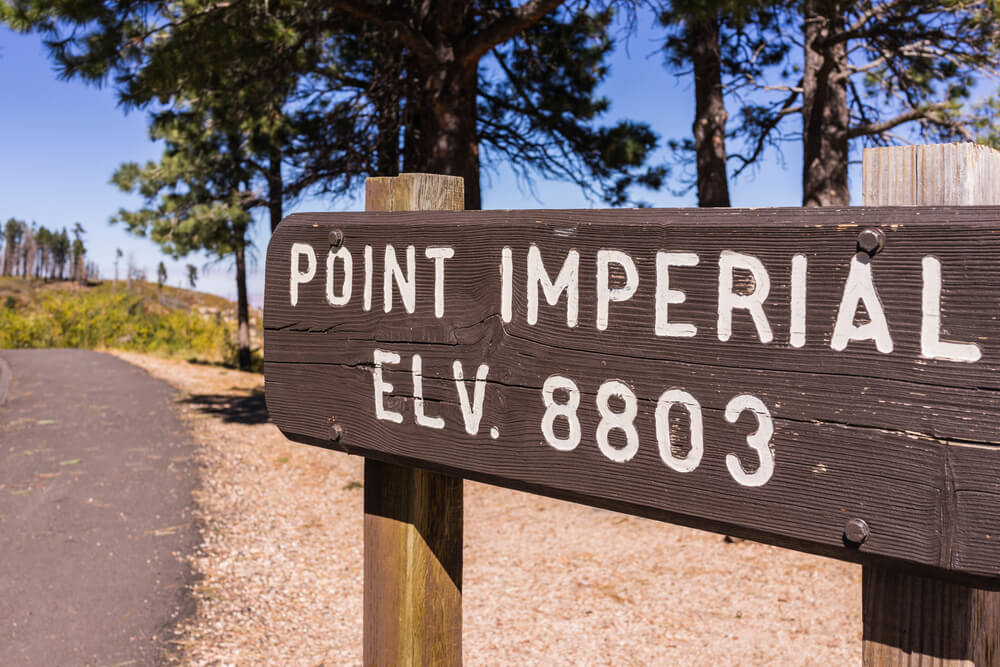 Sign that reads "point imperial elevation 8803"
