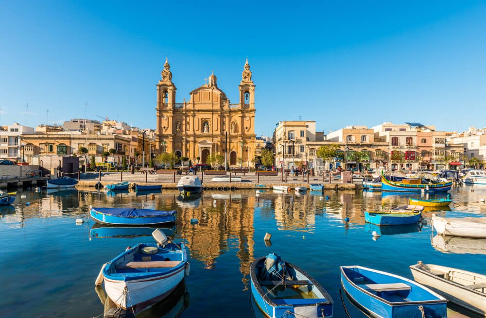 Small harbor and baroque church in Sliema, on the island of Malta