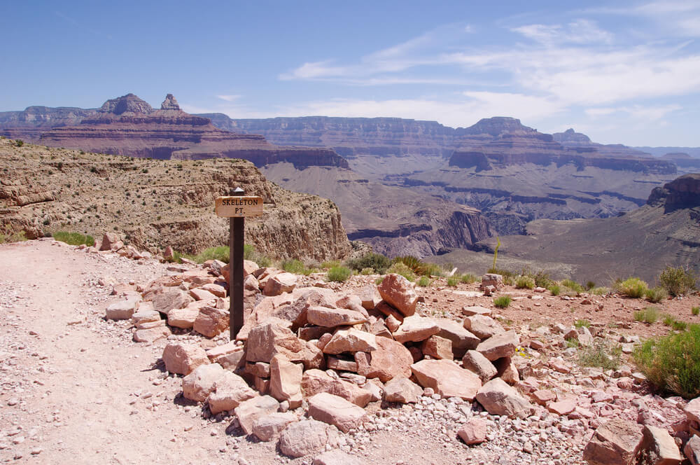 a sign reading skeleton point halfway down into the grand canyon with expansive views of the canyon everywhere you look