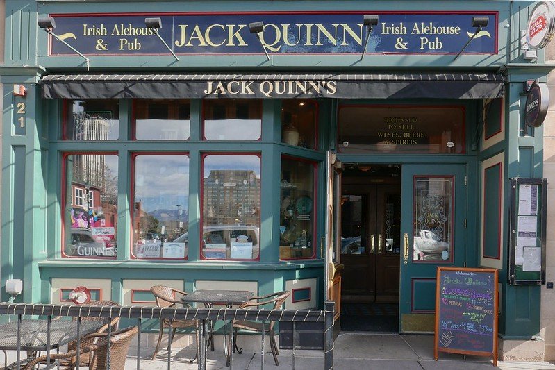 the green facade of the irish pub called jack quinn in colorado springs co -- a great spot to visit on a weekend in colorado springs itinerary