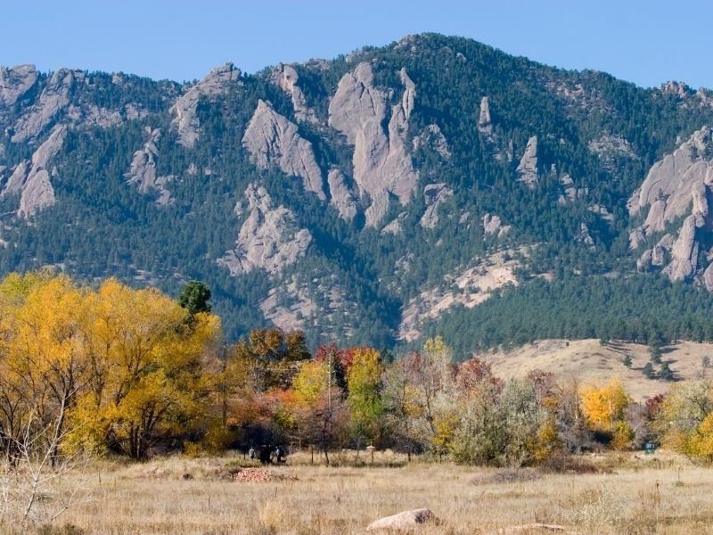 fall foliage in boulder colorado changing in front of the rocky mountains flatirons