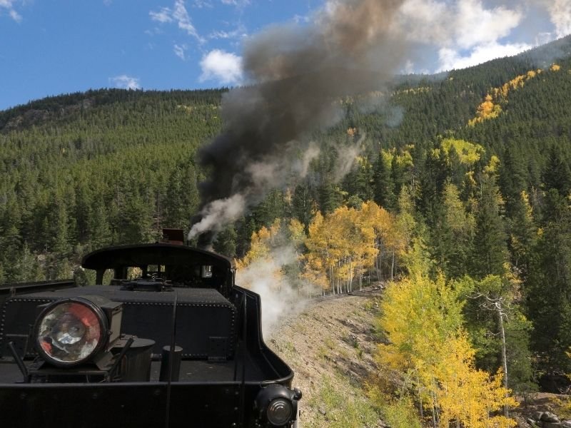 taking the georgetown loop railway with yellow aspens and evergreen trees