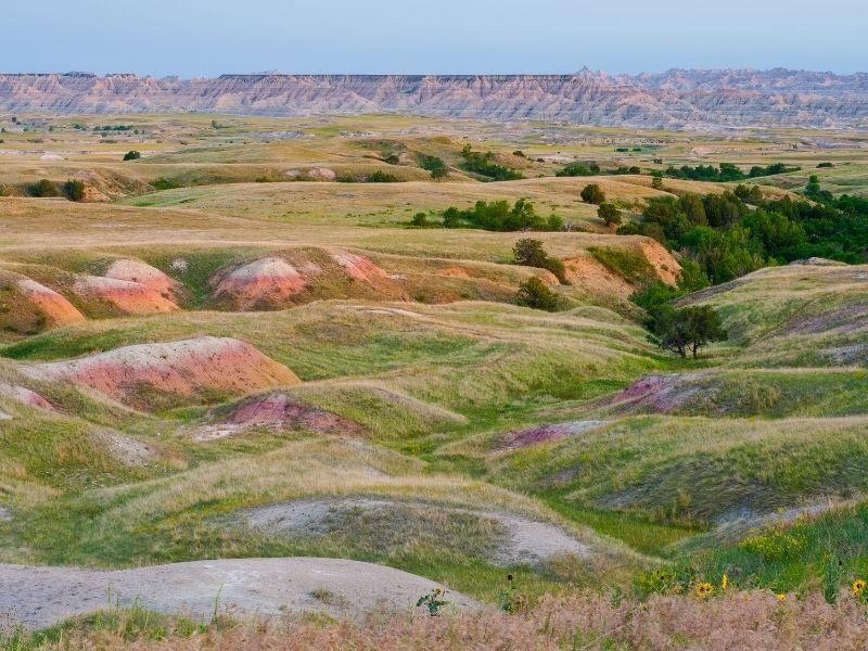 Driving through the Badlands along Sage Creek Road, seeing hills of beautiful colors