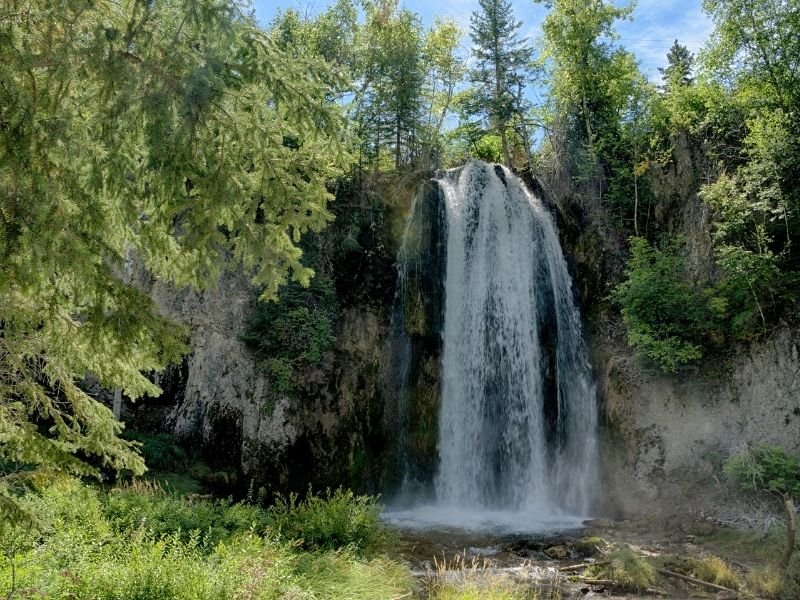 Waterfall in green oasis in Spearfish, South Dakota