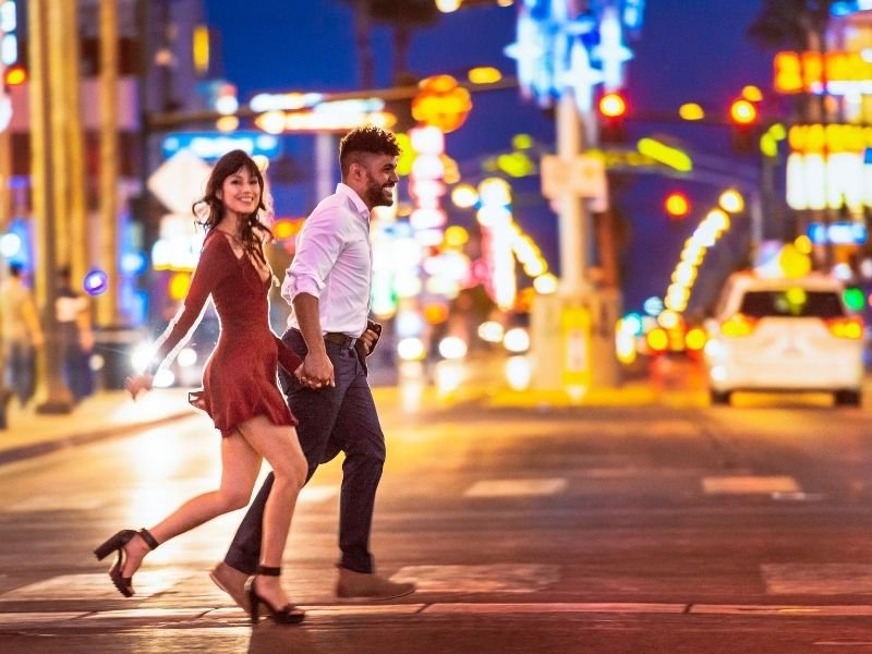 african american man and caucasian woman in heels going out for a night of dancing in las vegas