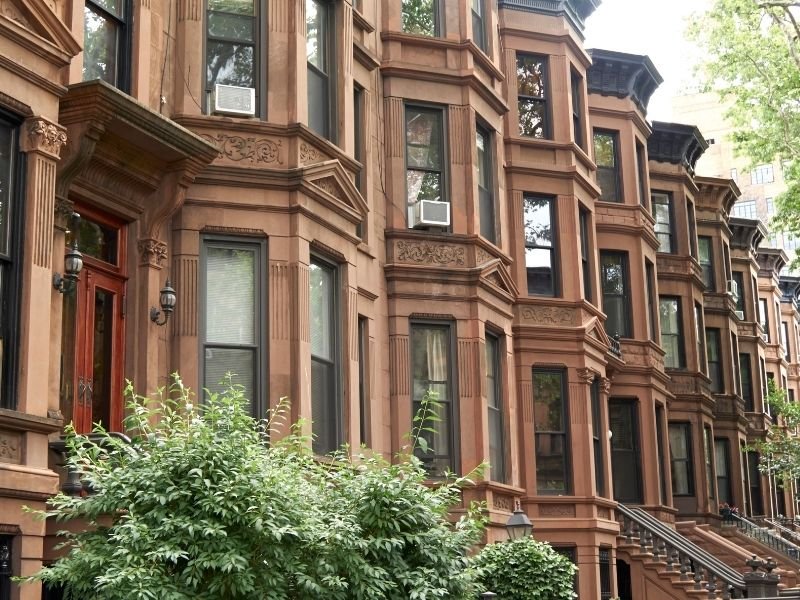 a row of brownstones in brooklyn new york with gorgeous architectural detailing