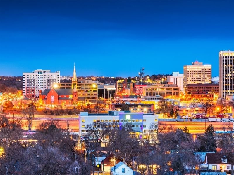 Colorado Springss all lit up at night with beautiful colors and neon lights