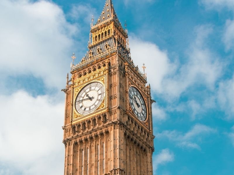 clock face of big ben on a partly cloudy day in london