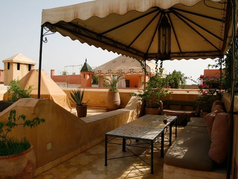 rooftop canopy of a hotel in marrakech with a shady place to enjoy the marrakech skyline