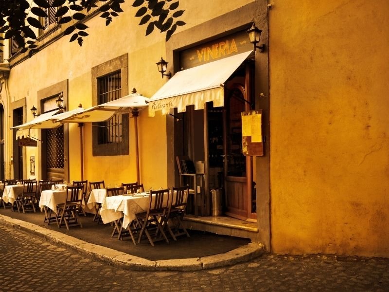 eating at a restaurant in italy in rome at night