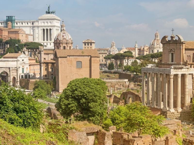 View of ancient Roman ruins and Rome cityscape while spending one day in Rome