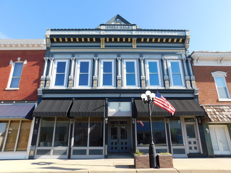 the arcola opera hall with an american flag out in front