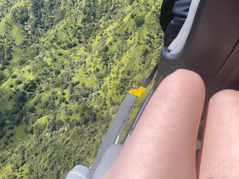 Cold bare legs on a doors off helicopter tour of Kauai