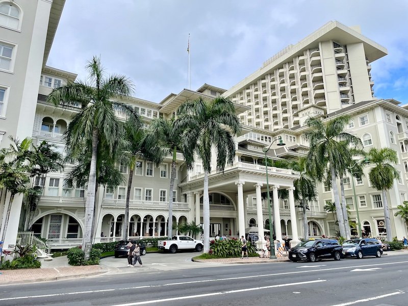 The exterior of the fancy Moana Surfrider hotel which is located beachfront in Waikiki