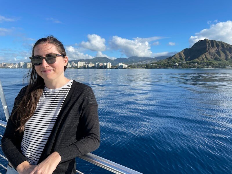 Allison in front of Waikiki skyline and Diamond head on a whale watching tour