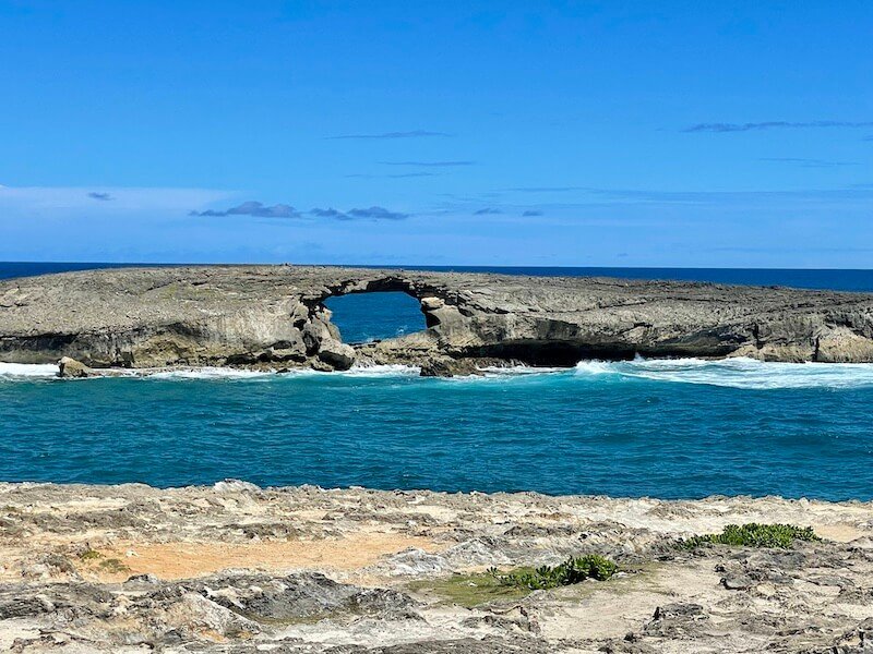 natural arch in the middle of the sea at laie point