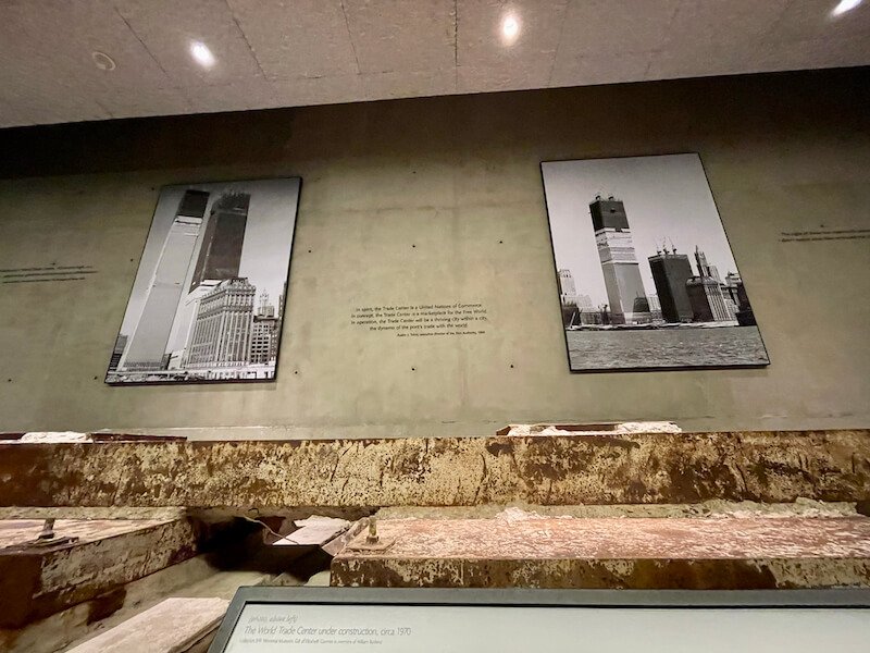 at ground zero at the 9/11 museum looking at the foundations and the photos of the world trade center as it was being created