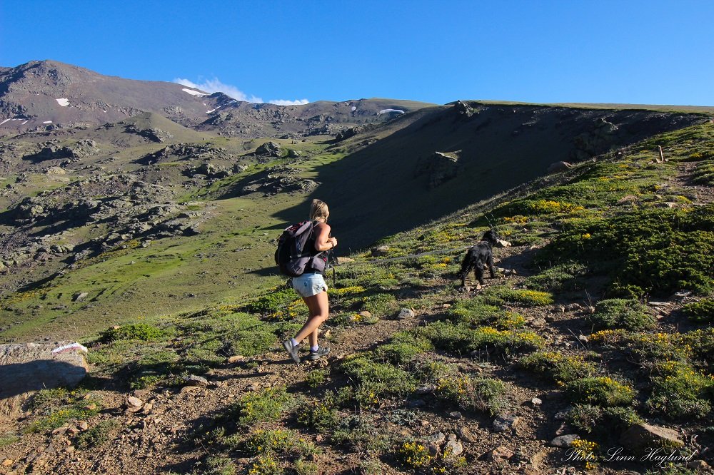 Hikers following a trail in Andalusia Spain while using hiking apps to find their way