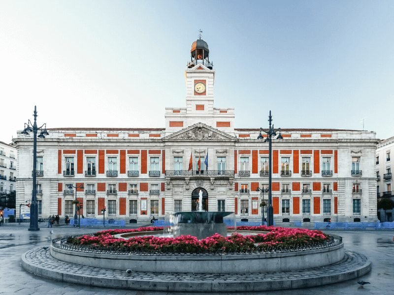 the famous puerta del sol is the perfect place to base yourself for your weekend in madrid (fountain, famous post office, clocktower)